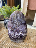 Humming Bird and Flower Carved in Chevron Amethyst