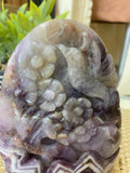 Humming Bird and Flower Carved in Chevron Amethyst